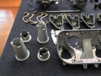 NC35 carb parts2 airbox plate and funnels.jpg